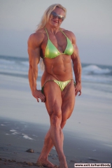 Amazing Muscle Babe posing outdoors