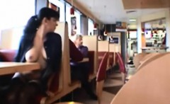 Dark haired girl flashing boobs in public restaurant