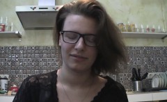 Solo girl with glasses chatting in the kitchen