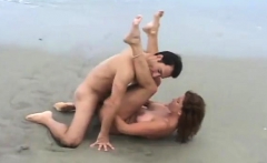 Teen flashing big boobs on windy beach