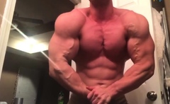 muscle guy showing off his super built