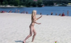 Adorable nudist teen sunbathes nude