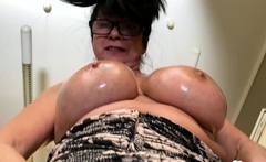 Horny milf rubs her incredibly large boobs